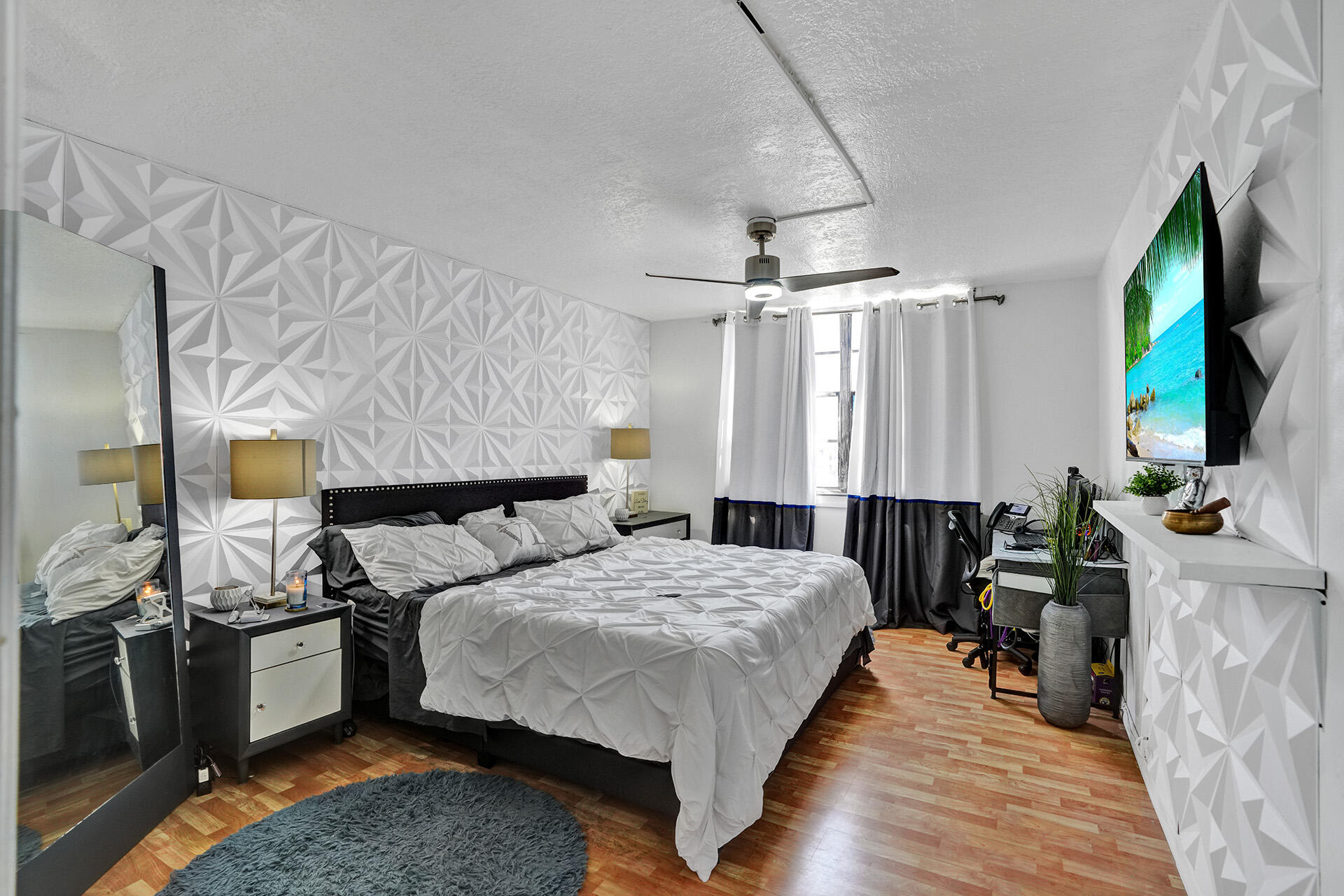 6193 Rock Island Road, Unit 405 Tamarac, FL 33319 - Photo 33 of 42 a bed room with a bed and a television