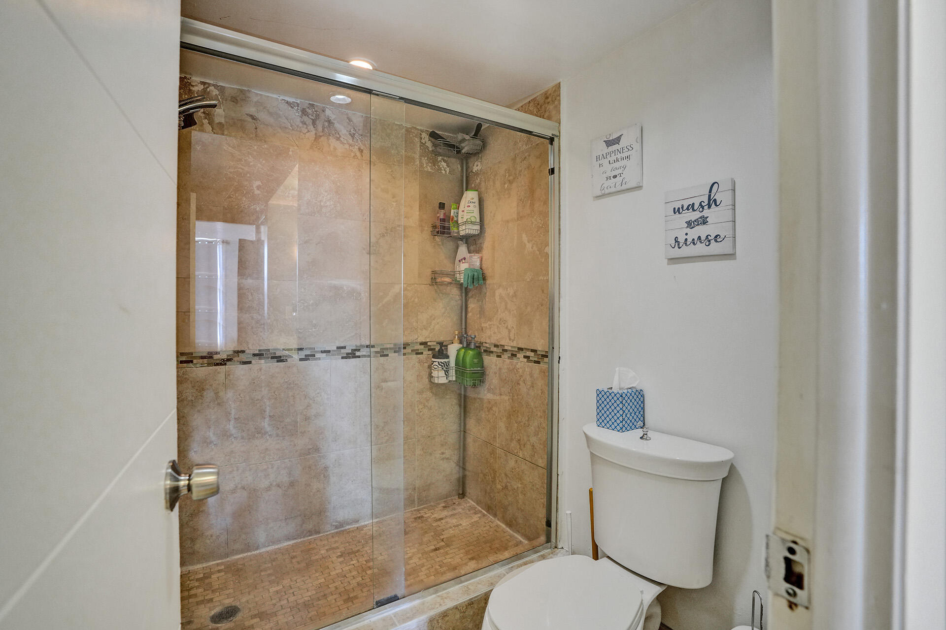6193 Rock Island Road, Unit 405 Tamarac, FL 33319 - Photo 39 of 42 a bathroom with a shower a toilet and a sink