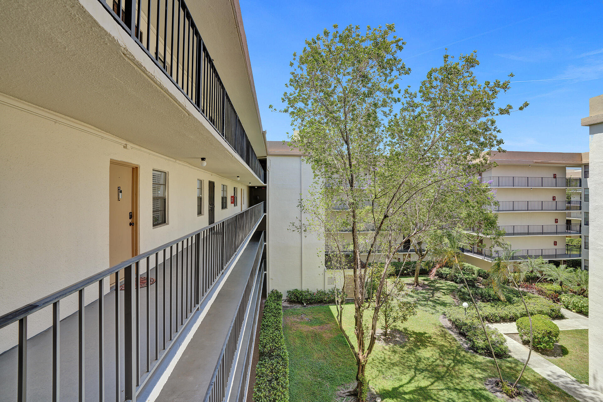 6193 Rock Island Road, Unit 405 Tamarac, FL 33319 - Photo 41 of 42 a view of a pathway of a building