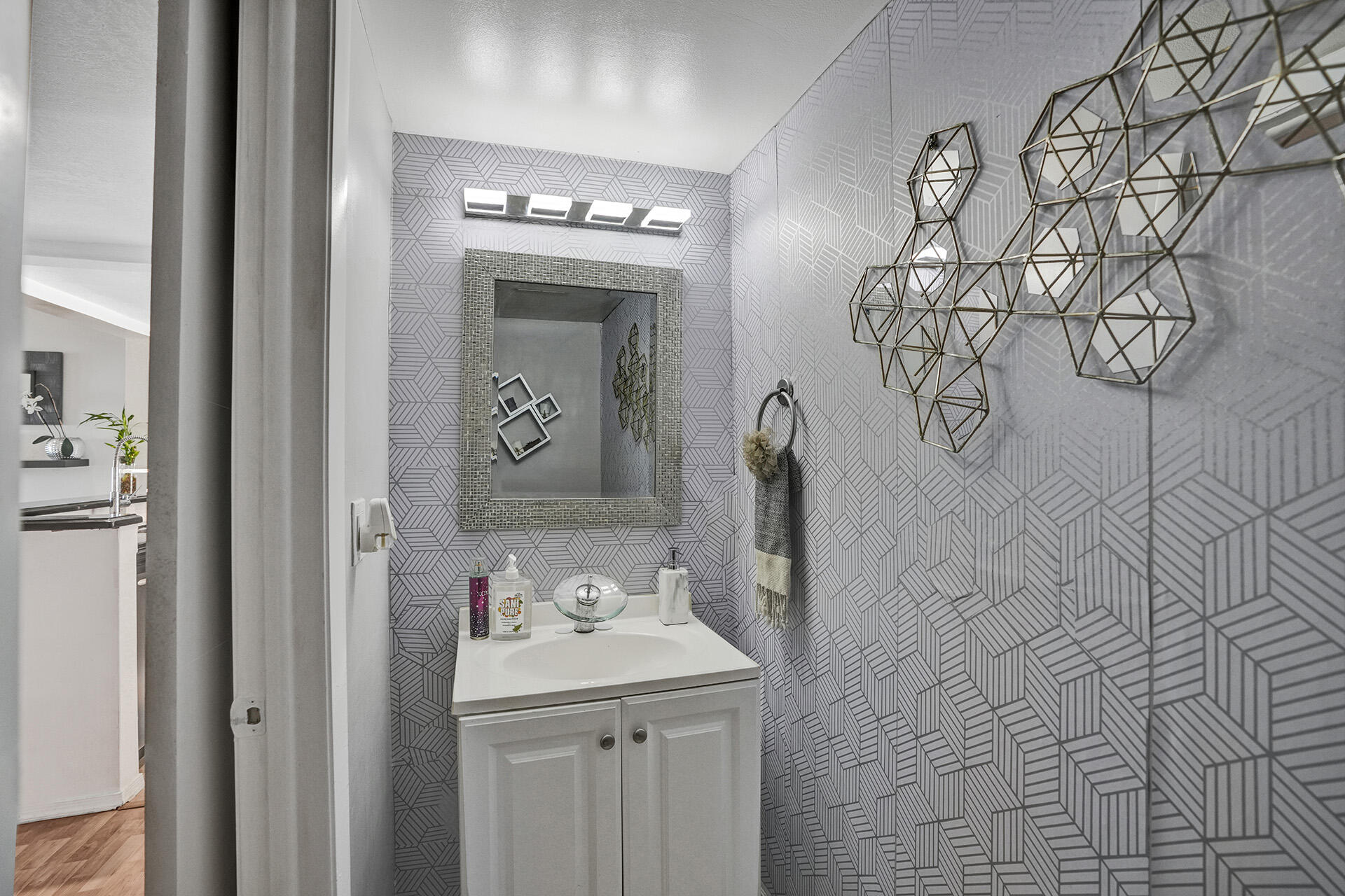 6193 Rock Island Road, Unit 405 Tamarac, FL 33319 - Photo 6 of 42 a bathroom with a sink and mirror