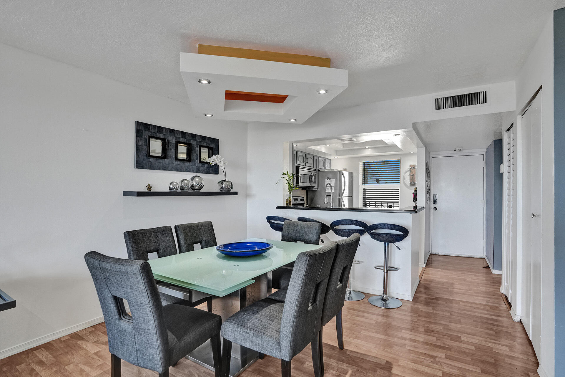 6193 Rock Island Road, Unit 405 Tamarac, FL 33319 - Photo 10 of 42 a view of a dining room with furniture and wooden floor