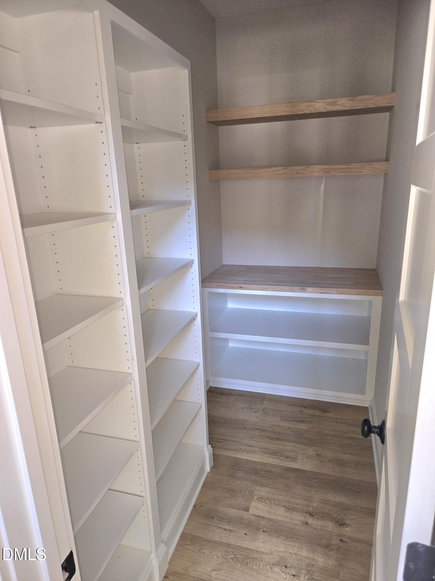 300 Avery Road Erwin, NC 28339 - Photo 4 of 38 a view of walk in closet with empty racks