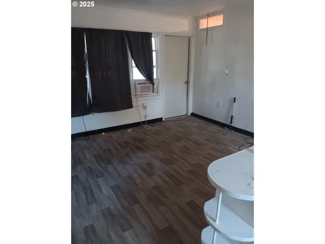 a view of a closet with an empty room