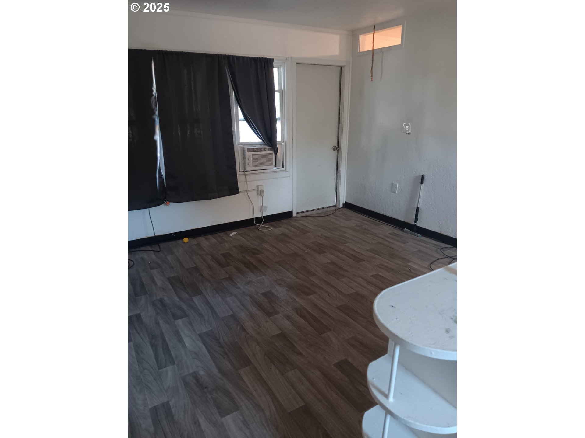 210 Jefferson Street West Huntington, OR 97907 - Photo 10 of 14 a view of an empty room with wooden floor
