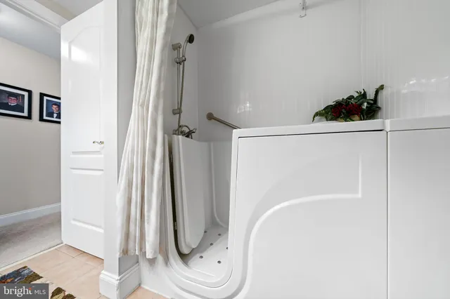 a bathroom with a shower and a mirror