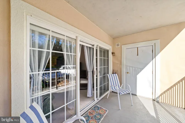 a view of entryway with wooden floor and door