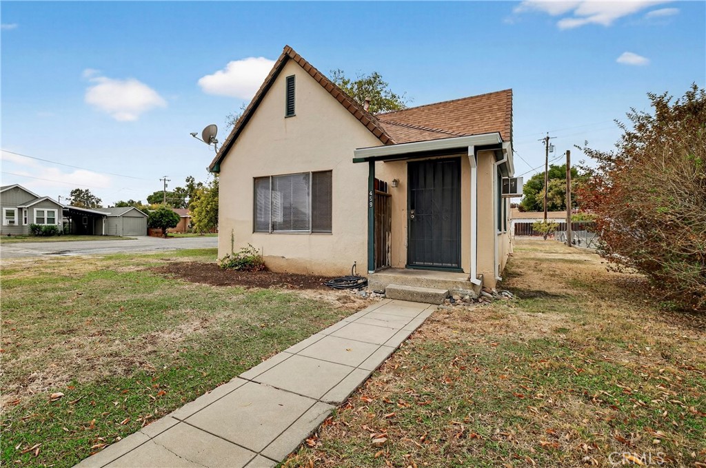 459 South Butte Street Willows, CA 95988 - Photo 2 of 44 a view of a house with backyard and trees