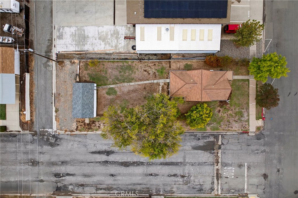 459 South Butte Street Willows, CA 95988 - Photo 36 of 44 a bathroom with a granite countertop sink and a potted plant