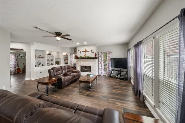 a living room with furniture and a fireplace