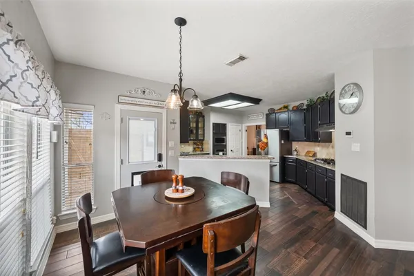 a view of a dining room with furniture