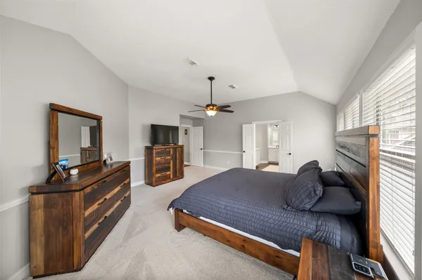 a view of a chair and table in backyard of the house