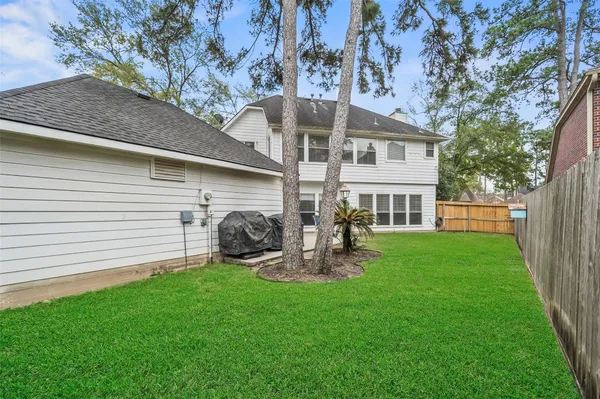 a front view of house with yard and outdoor seating