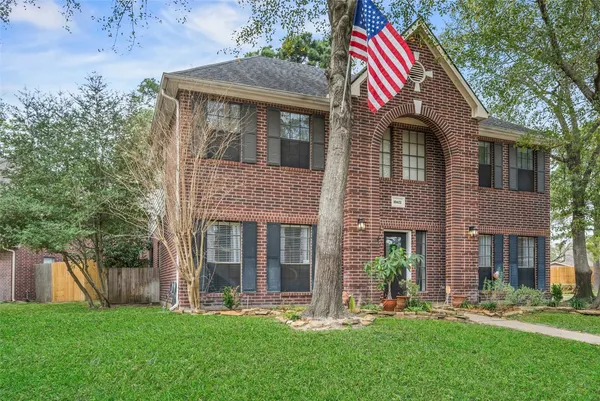 a front view of a house with a yard and porch