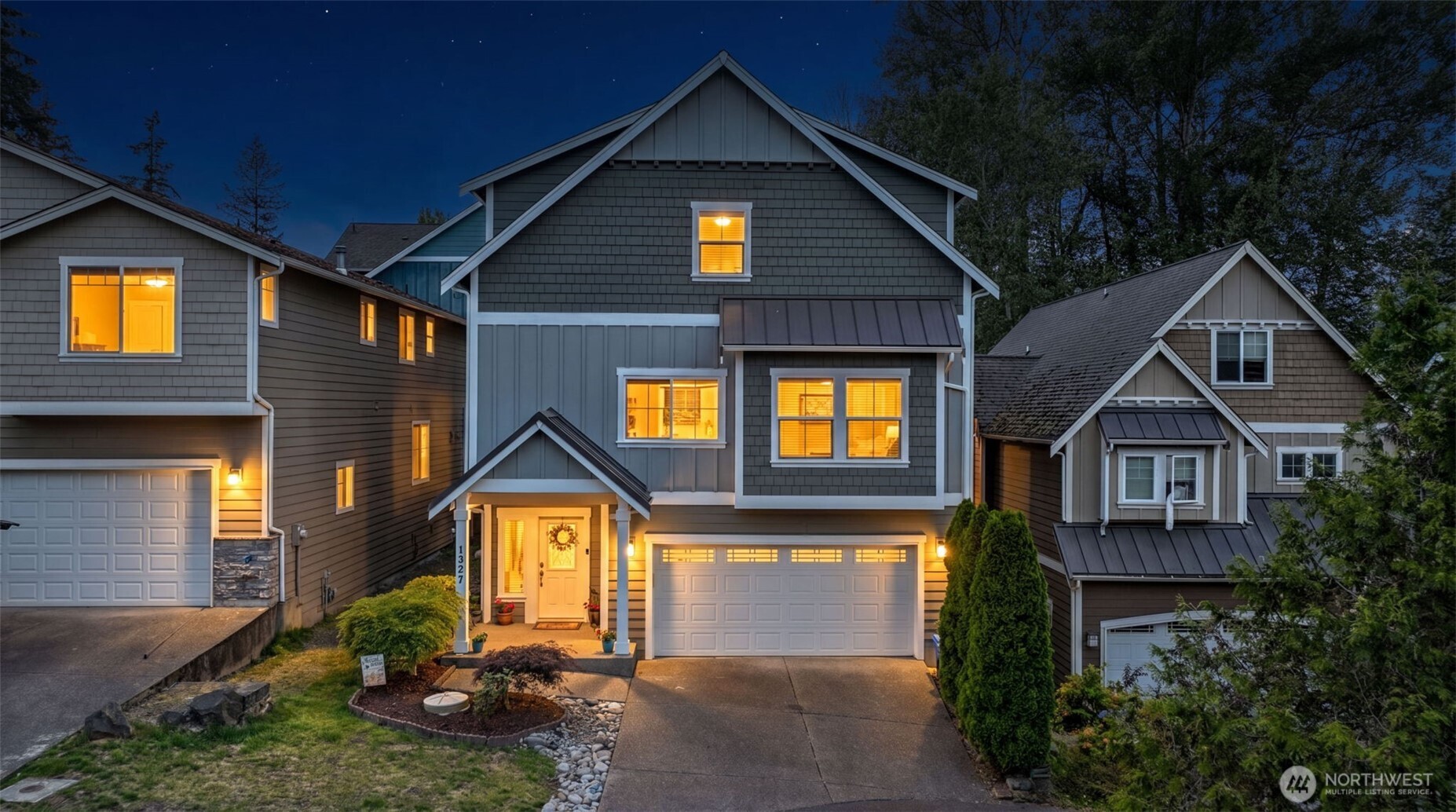 1357 Elma Place Northeast Renton, WA 98059 - Photo 1 of 40 a front view of a house with a yard and garage