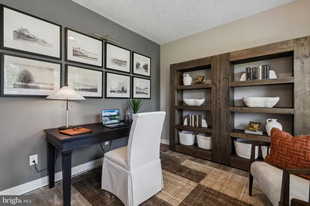 a living room with furniture and next to a window