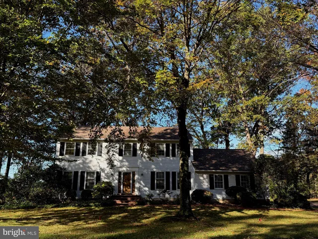 a front view of a house with a lake view