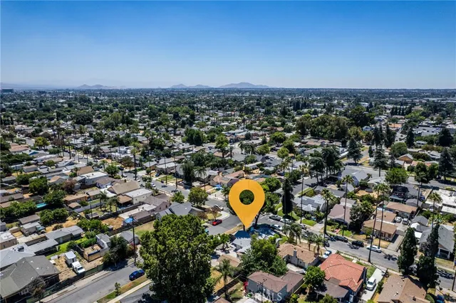 an aerial view of a house with a swimming pool