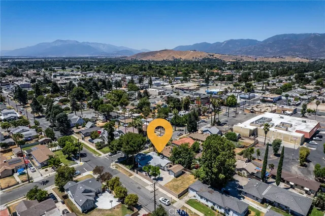 an aerial view of a house with a swimming pool