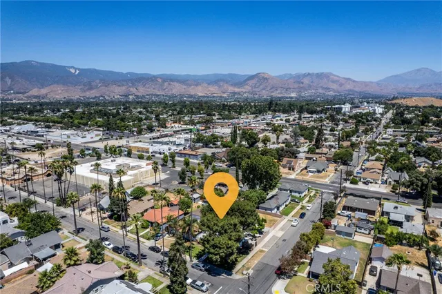 a view of a city with mountains in the background