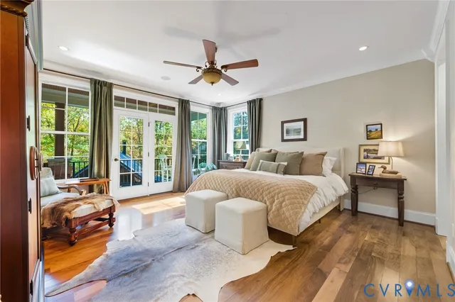 a spacious bedroom with a bed and a large window