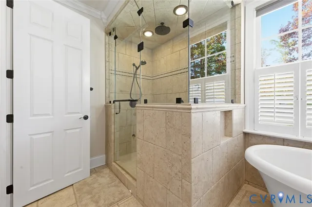 a bathroom with a bathtub and shower