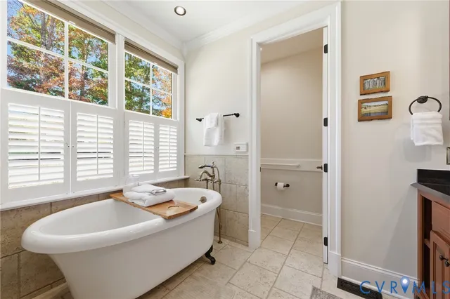 a bathroom with a bathtub and a sink
