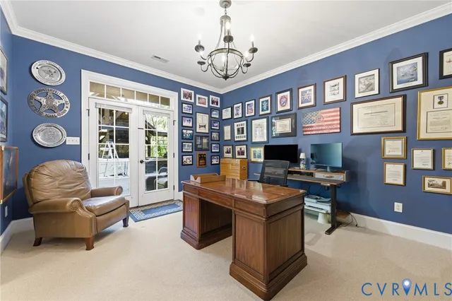 a view of a livingroom with workspace and a couch