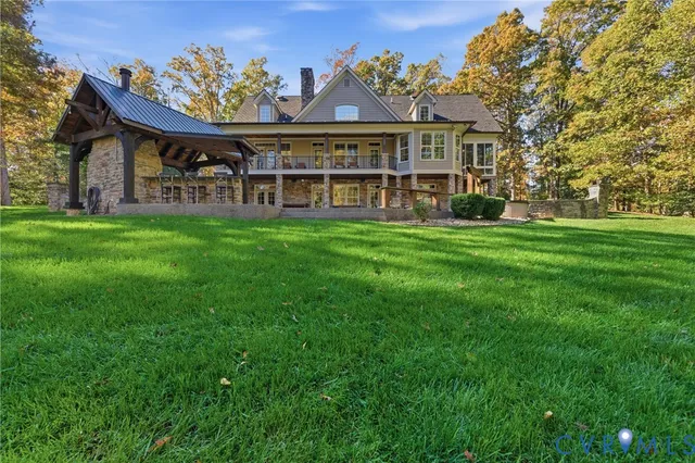 a view of a big room with a big yard and large trees