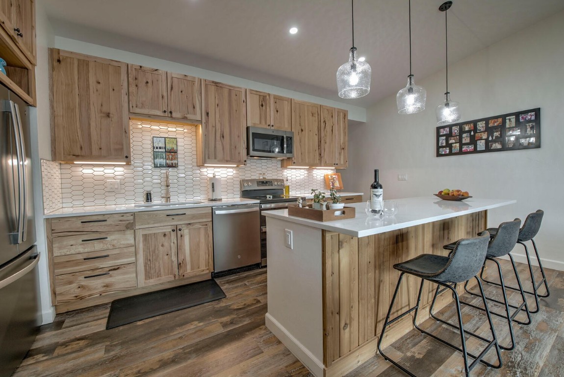 a kitchen with a sink cabinets and window