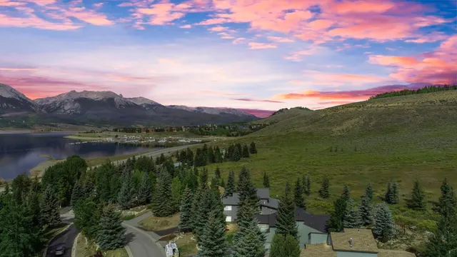 a view of a lake with a house in the background