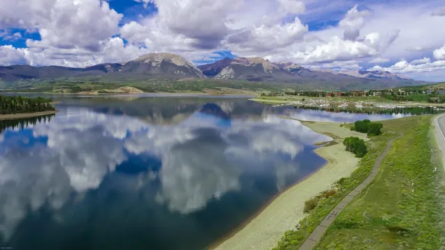 a view of lake with mountain in the background