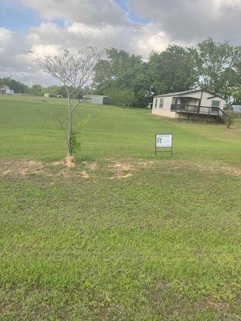 870 Choctaw Quitman, TX 75783 - Photo 1 of 6 a view of a lake with houses in the back