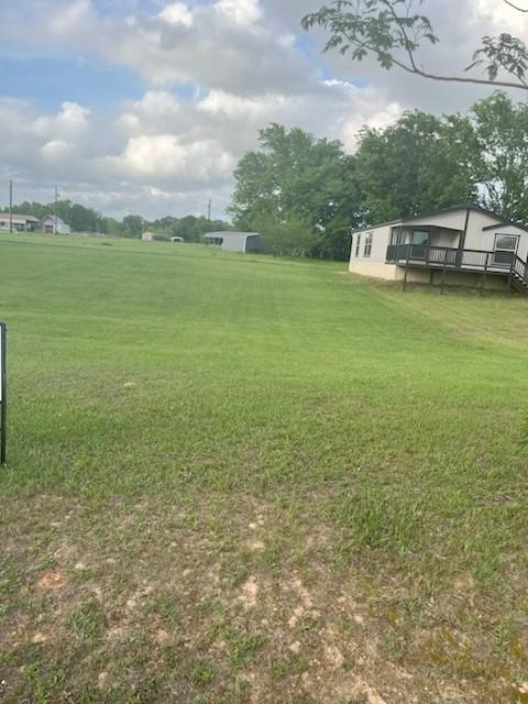 870 Choctaw Quitman, TX 75783 - Photo 2 of 6 a view of a lake with houses in the back