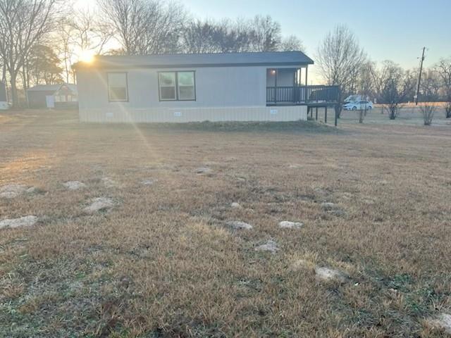 870 Choctaw Quitman, TX 75783 - Photo 6 of 6 a backyard of a house