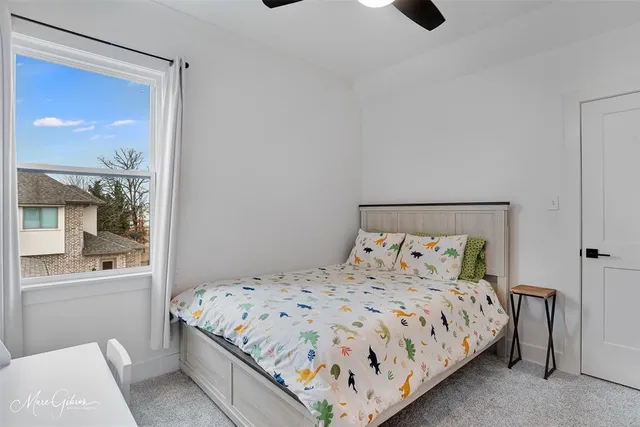 a bedroom with a bed and with a mirror