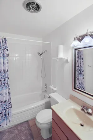 a bathroom with a sink a toilet and a bathtub