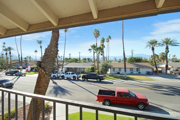 a view of a street with cars