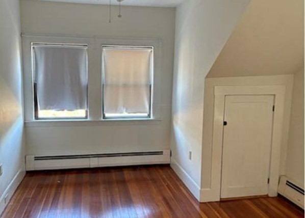 11 Otis Street Mansfield, MA 02048 - Photo 5 of 19 a view of a room with wooden floor and window