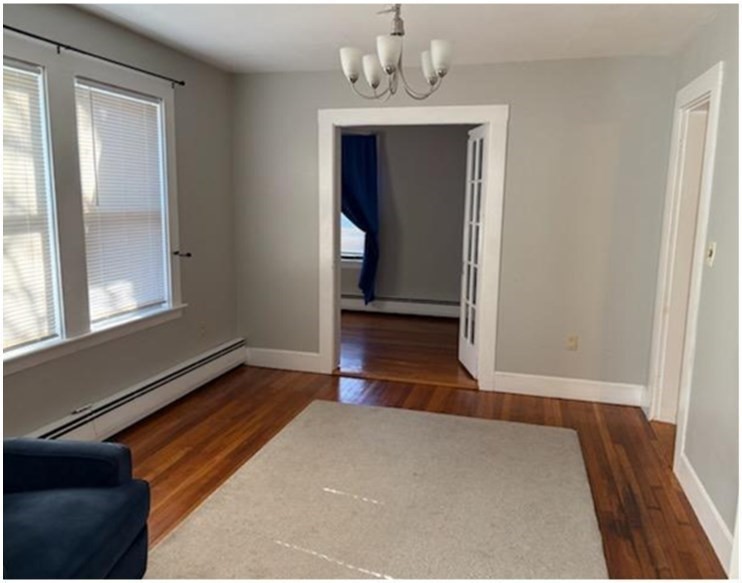 11 Otis Street Mansfield, MA 02048 - Photo 7 of 19 a view of empty room with wooden floor and fan