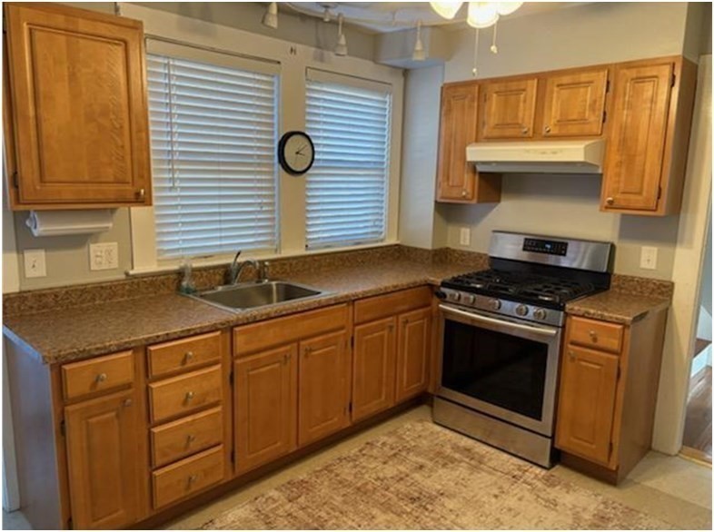 11 Otis Street Mansfield, MA 02048 - Photo 8 of 19 a kitchen with stainless steel appliances granite countertop a sink stove and cabinets