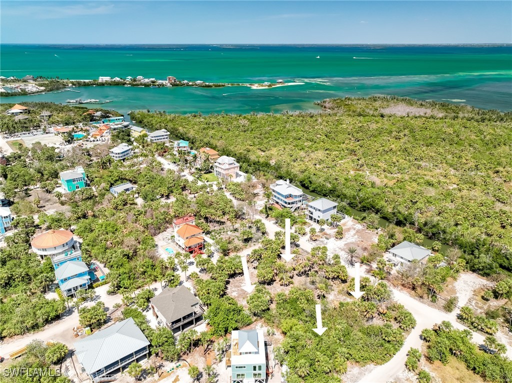 4430 Conch Shell Drive Upper Captiva, FL 33924 - Photo 15 of 32 a view of a golf course with a lake