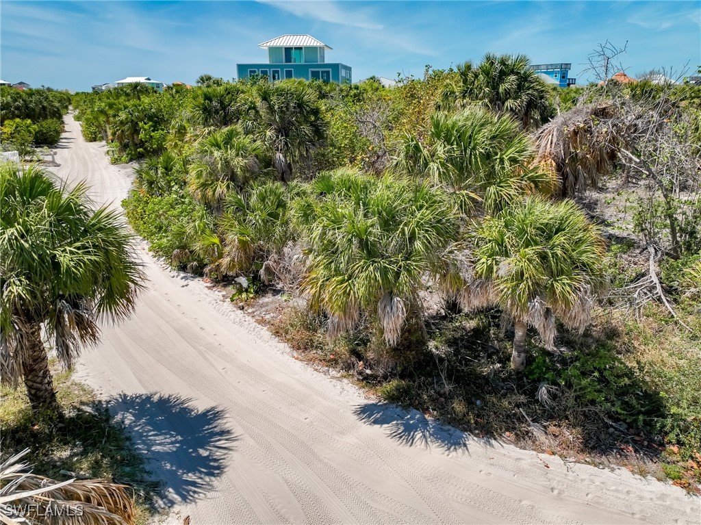 4430 Conch Shell Drive Upper Captiva, FL 33924 - Photo 30 of 32 an aerial view of a house with a yard