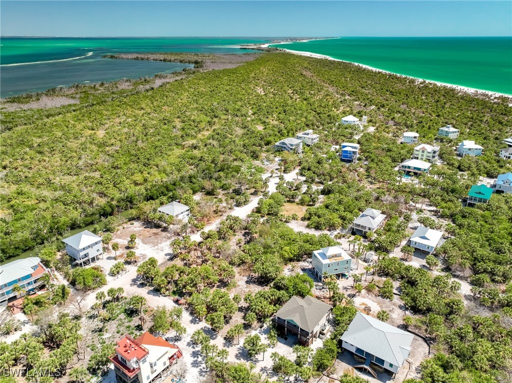 4430 Conch Shell Drive Upper Captiva, FL 33924 - Photo 10 of 32 a view of a field with an ocean view