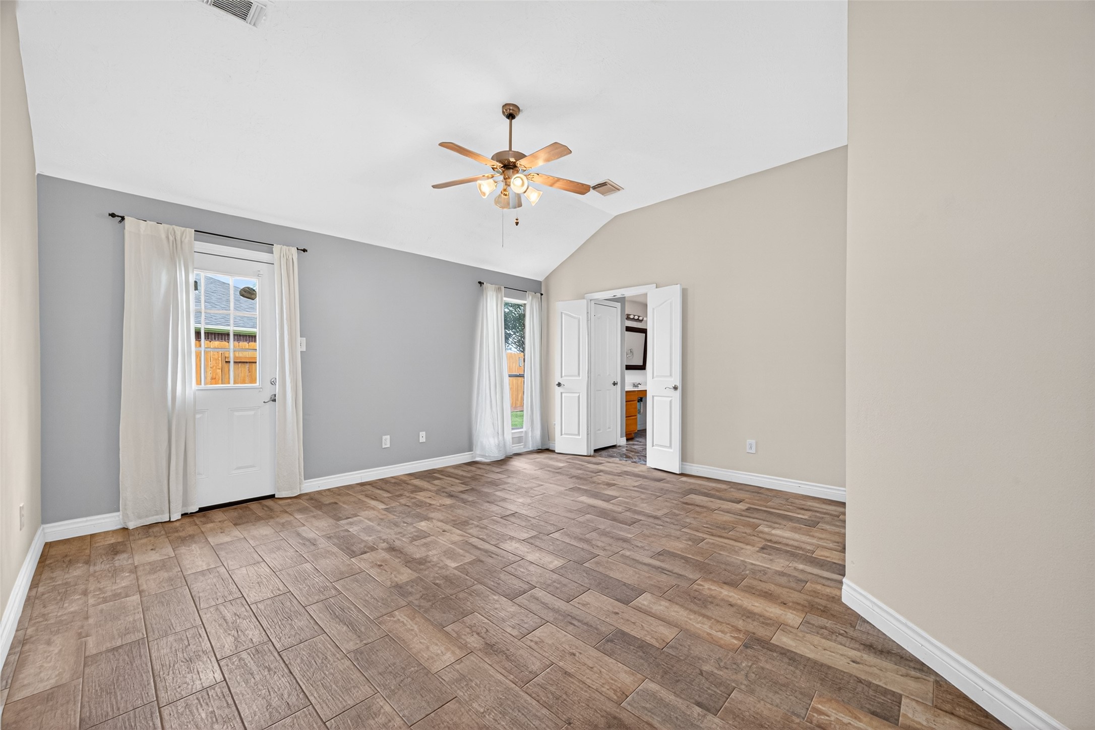 23914 Glengate Drive Spring, TX 77373 - Photo 22 of 49 a view of empty room with wooden floor and ceiling fan