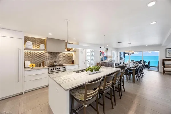 a kitchen with a table and chairs in it