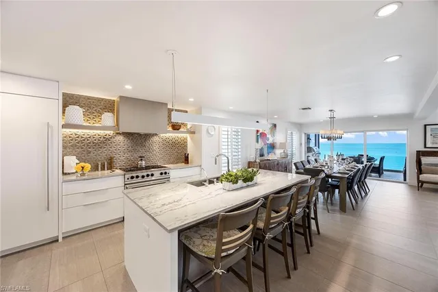a kitchen with a table and chairs in it