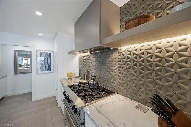 a stove top oven sitting inside of a kitchen