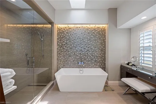a bathroom with a bathtub and toilet