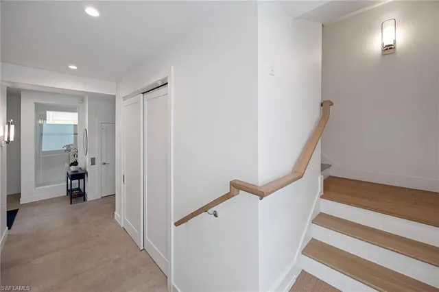 a view of a hallway with staircase and staircase