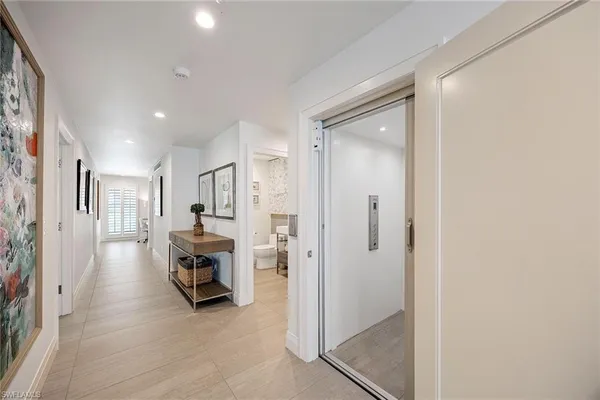 a view of utility room and front door